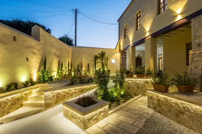 a courtyard of a building with a bunch of plants at Aelios Design Hotel in Chania Town
