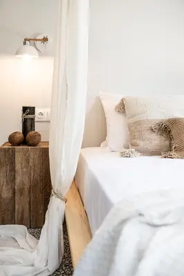 a bedroom with two beds and a curtain at Artemide city places-Splantzia Square in Chania Town