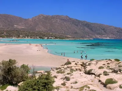 a group of people in the water at a beach at Modi Home in Vrísai