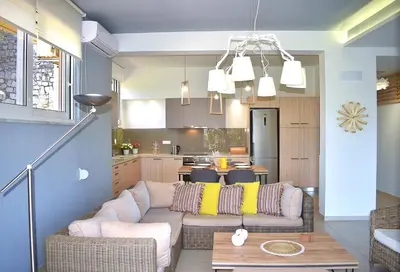 a living room with a couch and a table at Modi Home in Vrísai