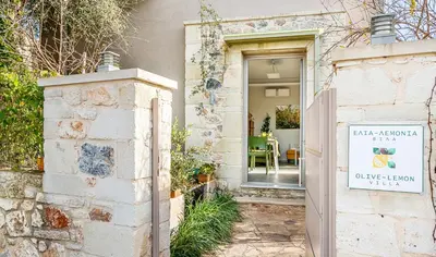 a door to a house with a sign that reads cider law at Olive Lemon Biophilic House & Lush Forest Garden in Vamos