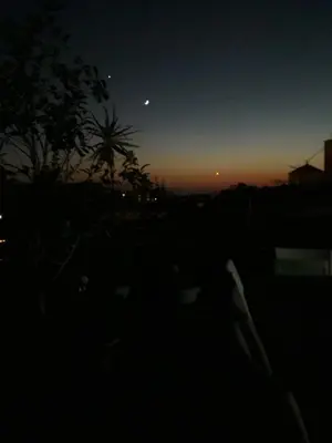 a night view of the sky with the moon at Parthenon Hotel in Souda