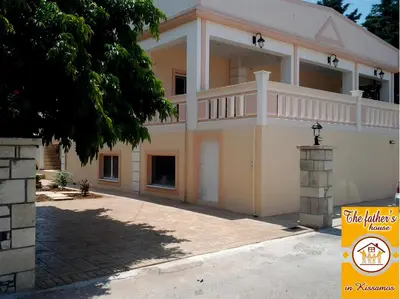 a large house with a balcony on top of it at father's house in kissamos in Korfalónas