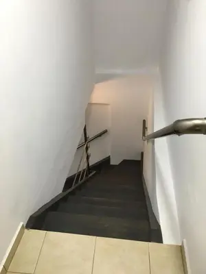 a staircase in a white building with a cross on it at Villa Martini in Kissamos