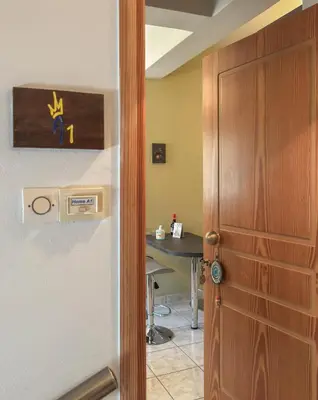 a door leading into a room with a table at Alisahni Home 1 in Kato Daratso