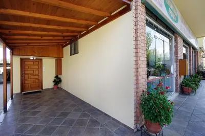 a porch of a building with a wooden ceiling at Penthouse in Chania Town