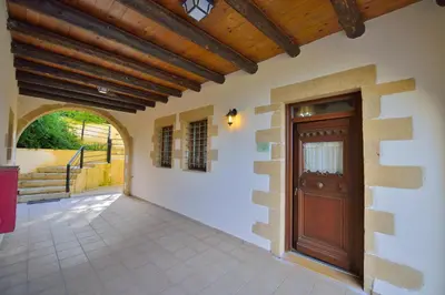 an entrance to a house with a wooden door at Maria Villas in Kissamos