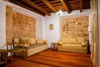 a living room with a couch and a table at Palazzo Duca in Chania Town