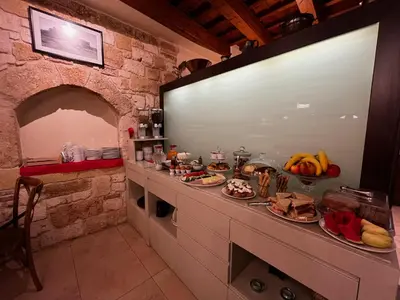 a kitchen with a counter with food on it at Palazzo Duca in Chania Town