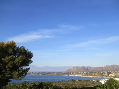 a view of a body of water with a tree at Theodosia Studios in Kalathas