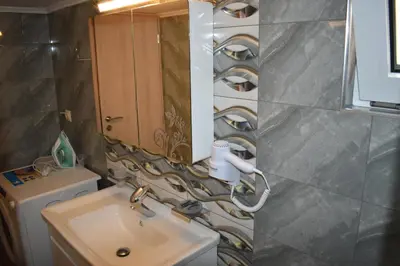 a bathroom with a sink and a mirror at Rodoula Luxury Αpartment 3 in Chania Town