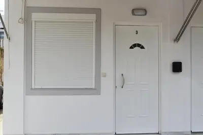 a white door with a window on it at Rodoula Luxury Αpartment 3 in Chania Town