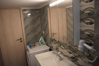 a bathroom with a sink and a mirror at Rodoula Luxury Αpartment 3 in Chania Town