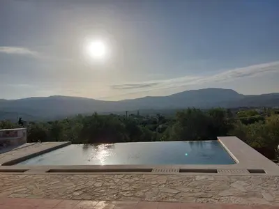 a swimming pool with a view of the mountains at Villa Vendema in Arménoi