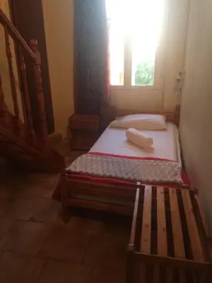 a bed in a room with a window at Rooms 47 in Chania Town