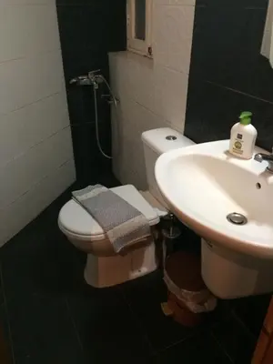 a bathroom with a toilet and a sink at Rooms 47 in Chania Town