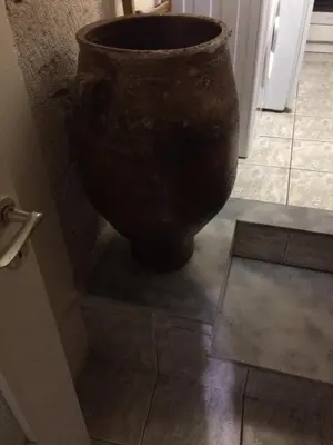 a large vase sitting on the floor in a room at Rooms 47 in Chania Town