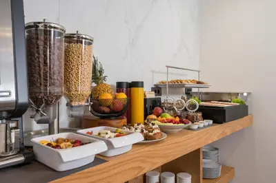 a buffet with bowls of food on a counter at Casa D'Irene Deluxe Hotel in Falasarna