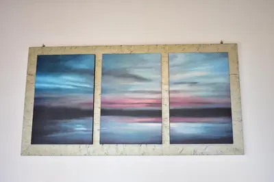a framed picture of a cloudy sky at Marinakis Sea View Studios in Sougia