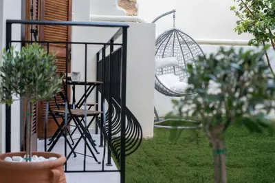 a balcony with a chair and a swing at Aelia Apartments in Chania Town