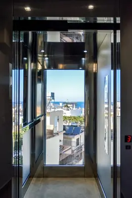 an elevator door with a view of a city at Elia Kalamaki Hotel in Kalamaki Chanion