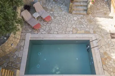 an overhead view of a swimming pool in a backyard at Olive Villas in Kría Vrísi