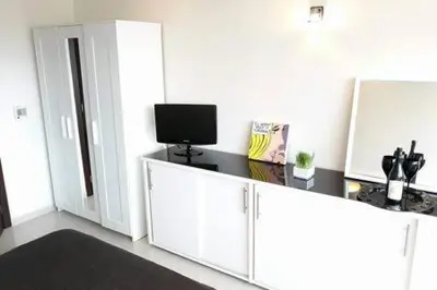 a room with a desk with a television on it at Heart City Executive Suite in Chania Town