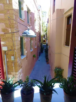 an alley with potted plants and a street light at Antonia Traditional Estate in Chania Town