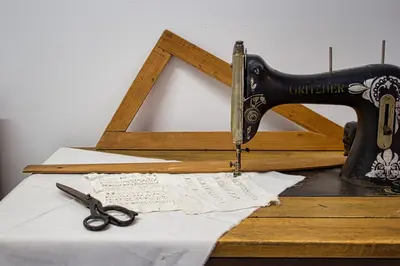 a sewing machine sitting on a table with a piece of paper at Antonia Traditional Estate in Chania Town