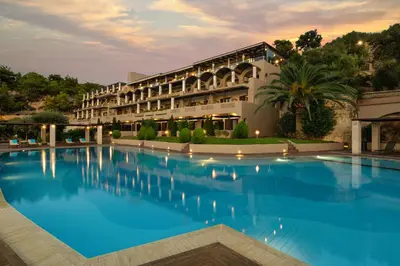 a large swimming pool in front of a building at Royal Sun in Chania Town