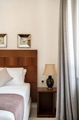 a bedroom with a bed and a table with a lamp at Villa Aloni in Kissamos