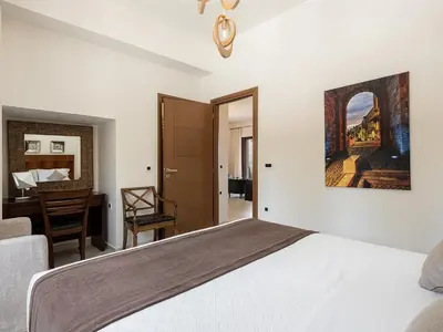 a bedroom with a bed and a desk at Villa Aloni in Kissamos