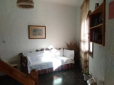 a bedroom with a bed in a room with a window at Lefka in Kolymvari