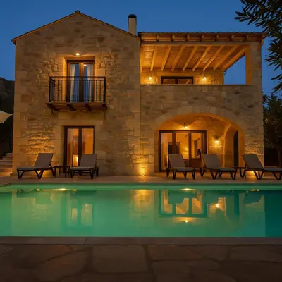 a villa with a swimming pool at night at Villa Antonousa - Private Pool Oasis in Kerá