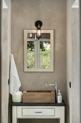 a bathroom with a sink and a mirror at Villa Antonousa - Private Pool Oasis in Kerá