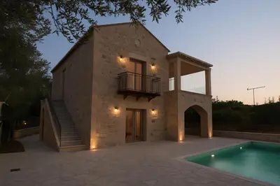 a villa with a swimming pool and a house at Villa Antonousa - Private Pool Oasis in Kerá