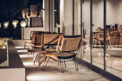 a group of chairs and a table in a room at Monastery Estate Retreat in Sougia