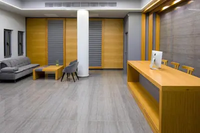 an office lobby with a couch and a table at Oscar Suites & Village in Agia Marina Nea Kydonias