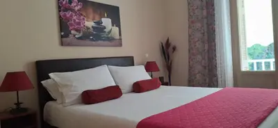 a bedroom with a large bed with a pink blanket at Modern Apartment Chania Center in Chania Town