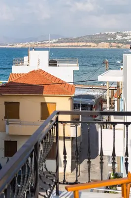 a balcony of a building with the ocean in the background at Sea View Penthouse with Roof Garden in Chania Town