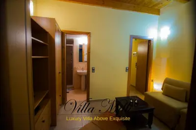 a living room with a couch and a bathroom at Villa Milli in Chania Town
