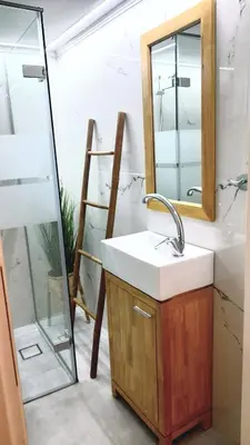 a bathroom with a sink and a mirror at Apartment Split Level in Chania Town