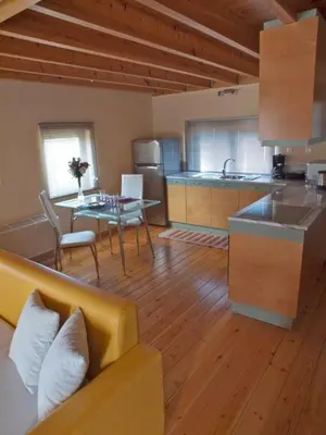 a kitchen with a couch and a table in a room at Sorta Apartments in Kato Daratso