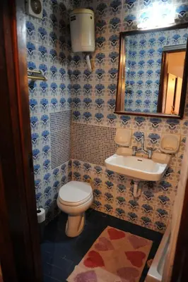 a bathroom with a toilet and a sink at Eleonora in Chania Town