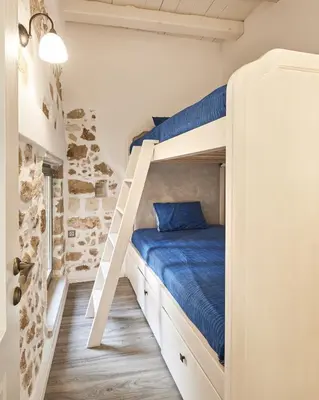 a bedroom with a bunk bed with a ladder at Estia Residence in Chania Old Town in Chania Town
