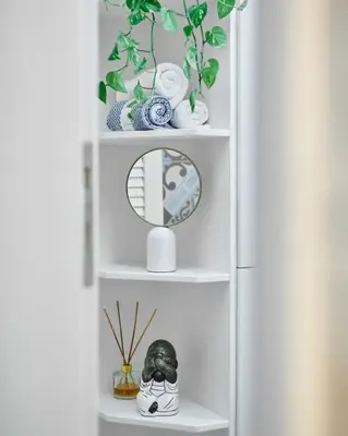 a white book shelf with vases and a mirror at Estia Residence in Chania Old Town in Chania Town