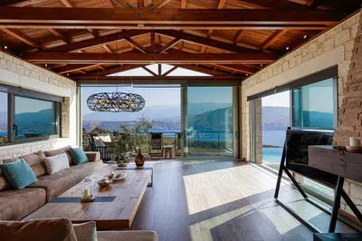 a living room with a couch and a table at Elements Villa in Galangádhos
