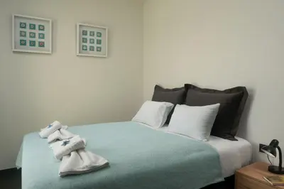 a bedroom with a bed with stuffed animals on it at Luxury Apartment with private pool in Tavronitis