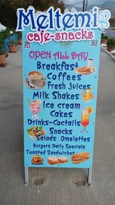 a sign for a restaurant with food and drinks at Yiorgos Studios in Palaiochóra