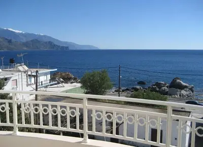 a view of the ocean from a balcony at Yiorgos Studios in Palaiochóra